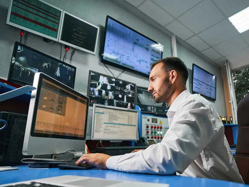 man managing a network to illustrate data backup and disaster recovery